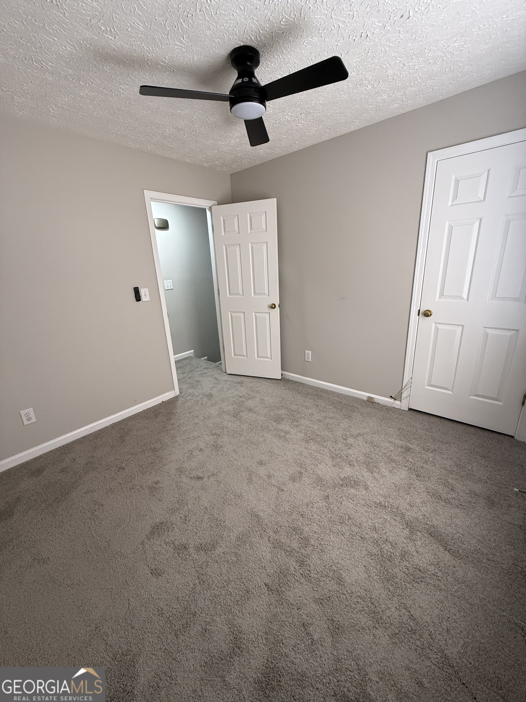 4144 Pinehurst Valley Drive Decatur, GA 30034 - Photo 21 of 31 an empty room with windows and fan