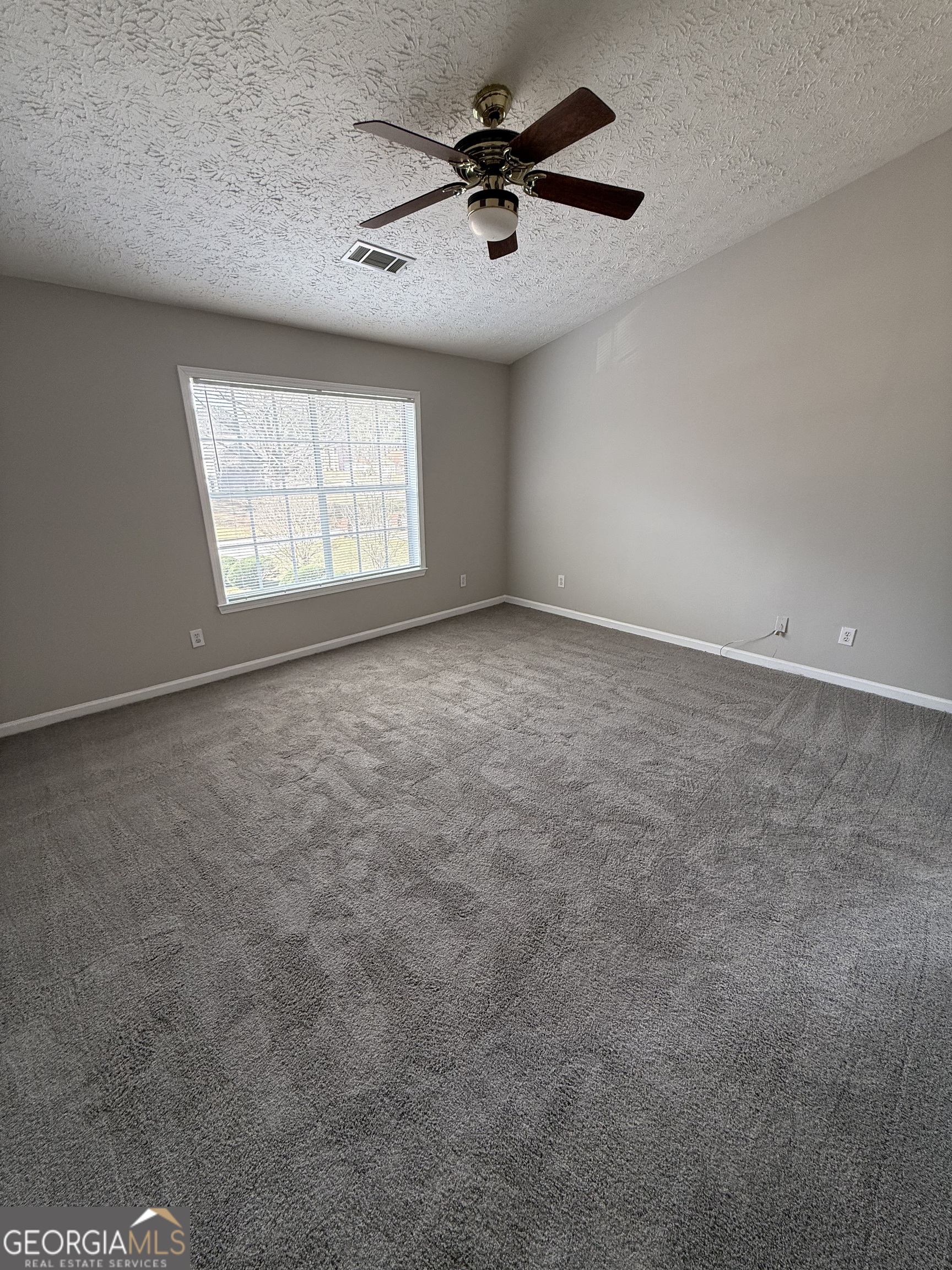 4144 Pinehurst Valley Drive Decatur, GA 30034 - Photo 24 of 31 an empty room with windows and fan