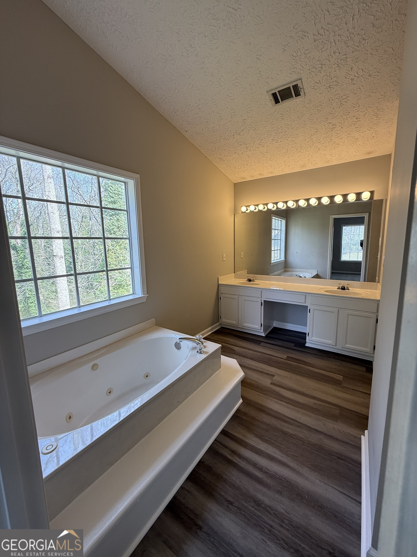 4144 Pinehurst Valley Drive Decatur, GA 30034 - Photo 28 of 31 a spacious bathroom with a large tub and sink