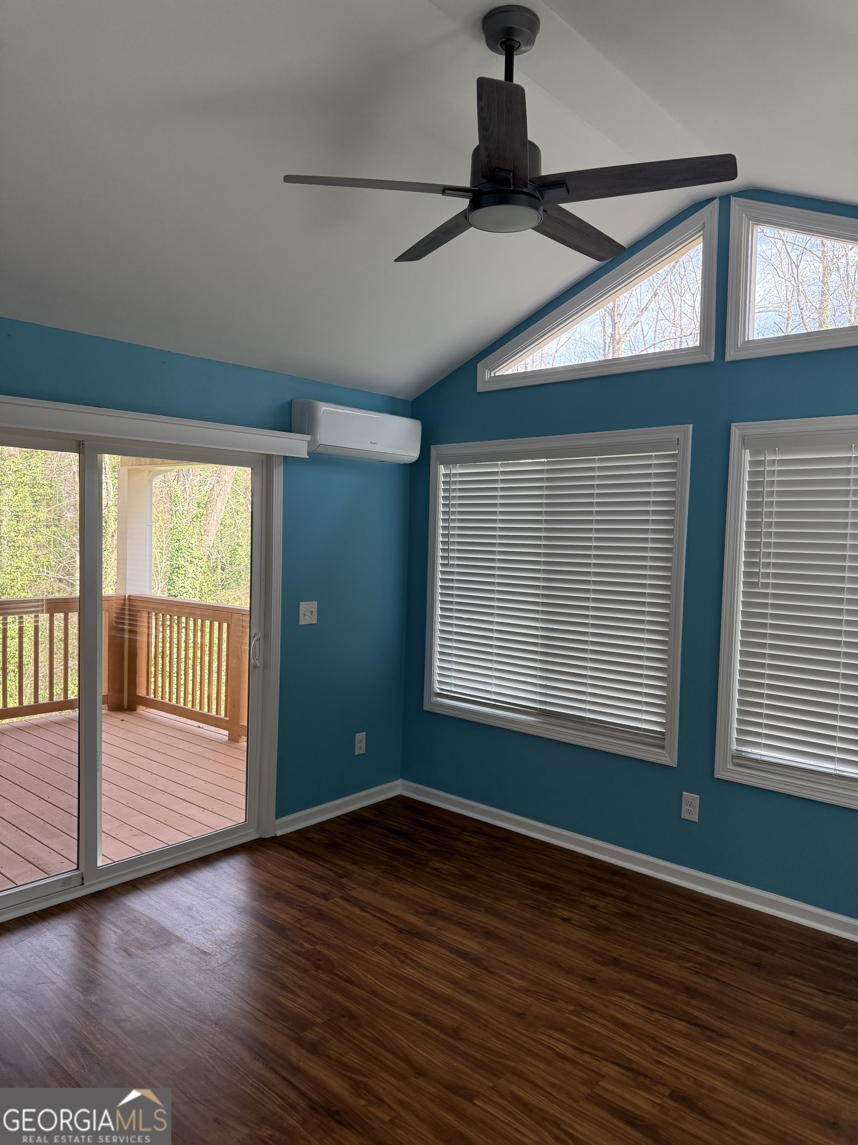 4144 Pinehurst Valley Drive Decatur, GA 30034 - Photo 9 of 31 a view of an empty room with wooden floor and a window