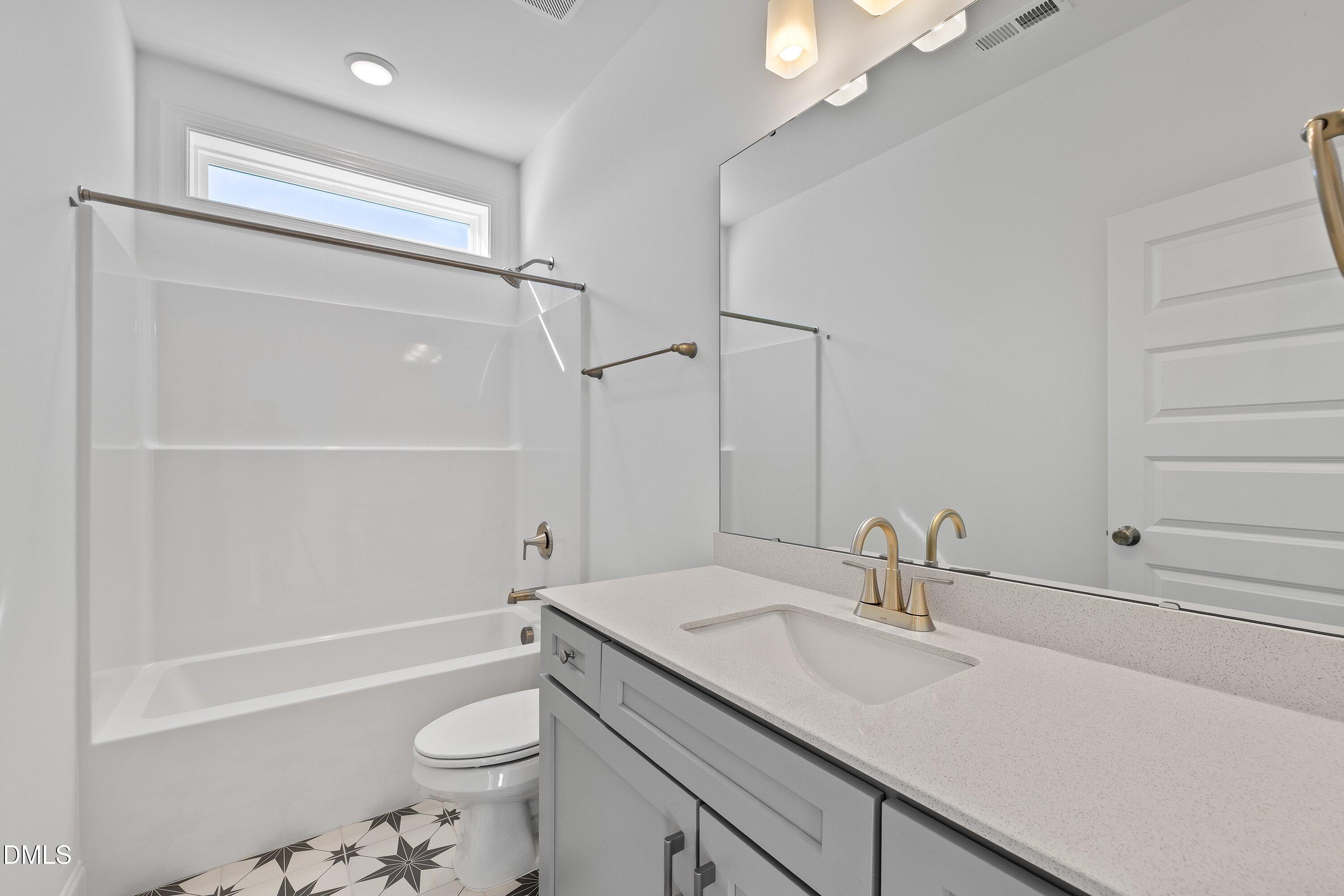 62 West Victoria Ridge Drive, Unit 19 Selma, NC 27576 - Photo 20 of 26 a bathroom with a sink a toilet and shower