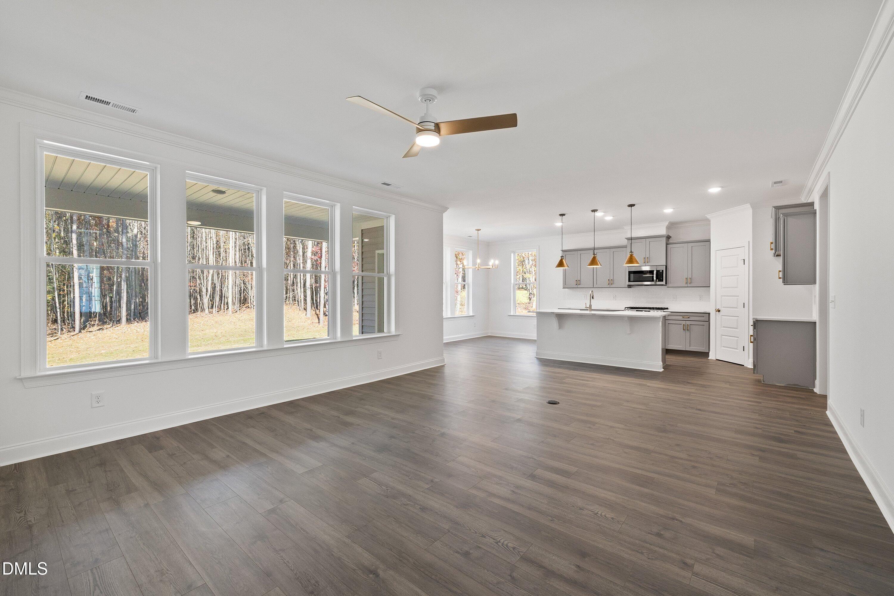 62 West Victoria Ridge Drive, Unit 19 Selma, NC 27576 - Photo 9 of 26 a view of kitchen with wooden floor and windows