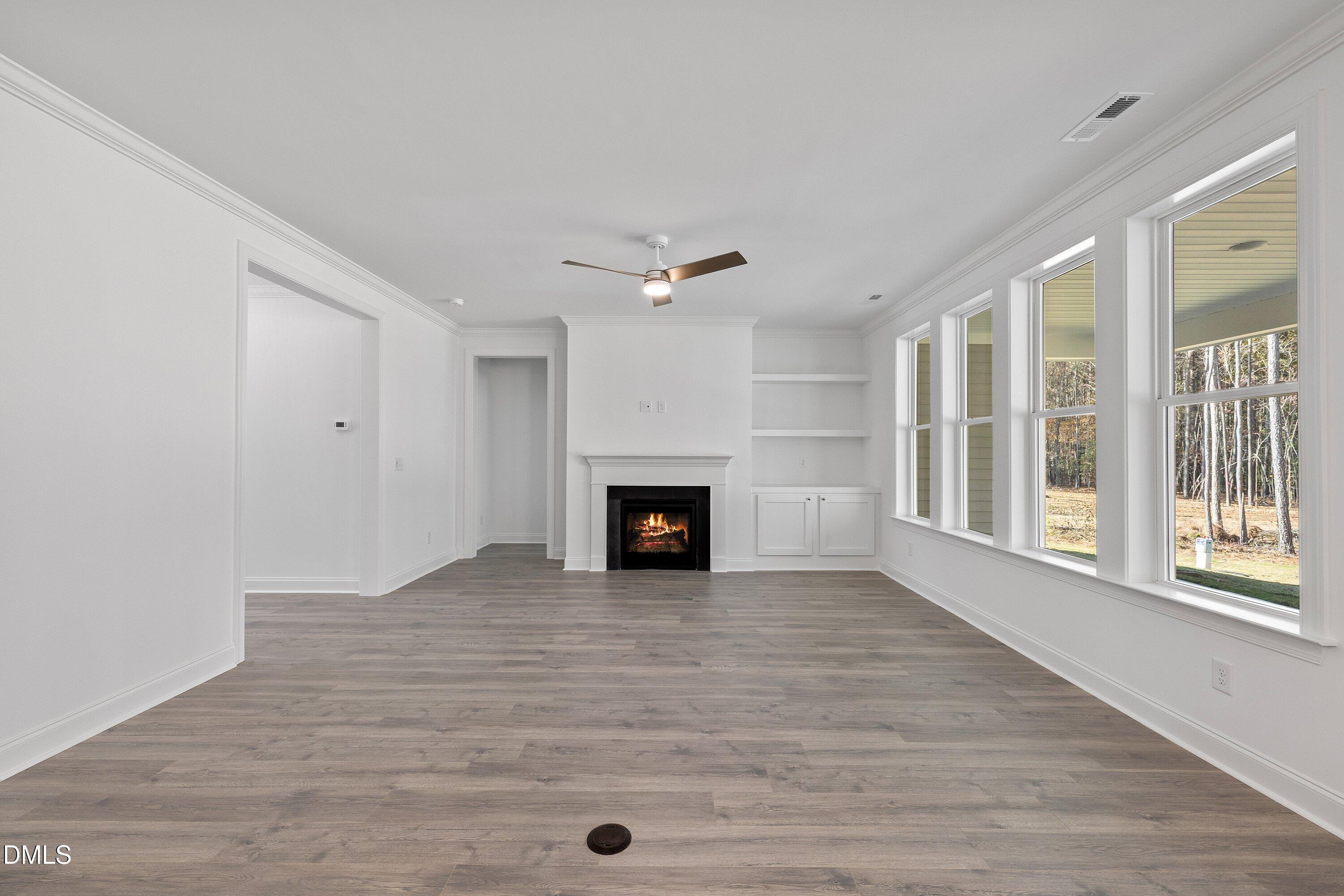 62 West Victoria Ridge Drive, Unit 19 Selma, NC 27576 - Photo 10 of 26 a view of a livingroom with a fireplace and window