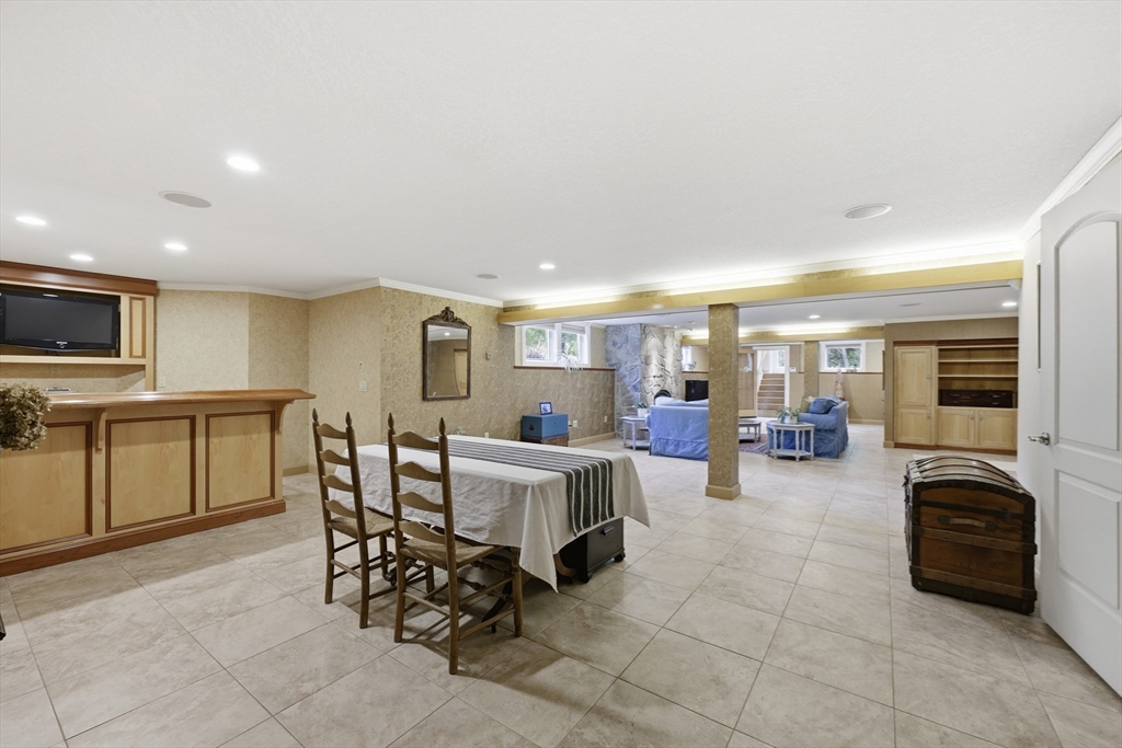 33 Labrie Lane Holyoke, MA 01040 - Photo 25 of 42 a living room with furniture a flat screen tv and kitchen view