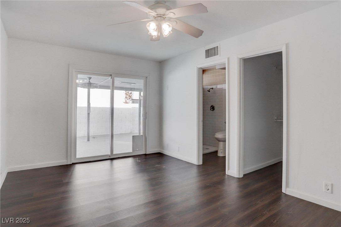4775 Monaco Road Las Vegas, NV 89121 - Photo 13 of 31 Empty room featuring dark wood-type flooring and ceiling fan
