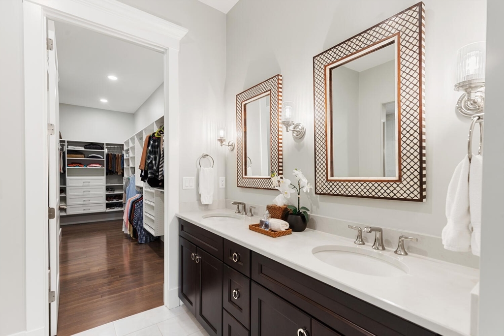 19 Gershon Way, Unit 1 Winchester, MA 01890 - Photo 22 of 42 a en suite bathroom with a granite countertop sink and a mirror