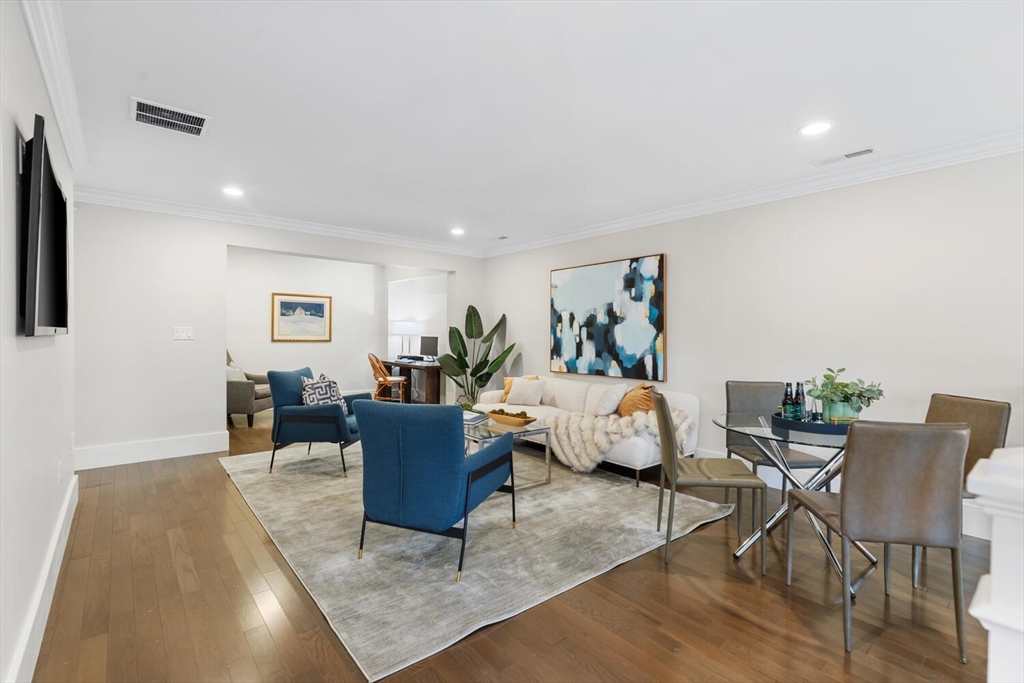 19 Gershon Way, Unit 1 Winchester, MA 01890 - Photo 27 of 42 a living room with furniture and wooden floor
