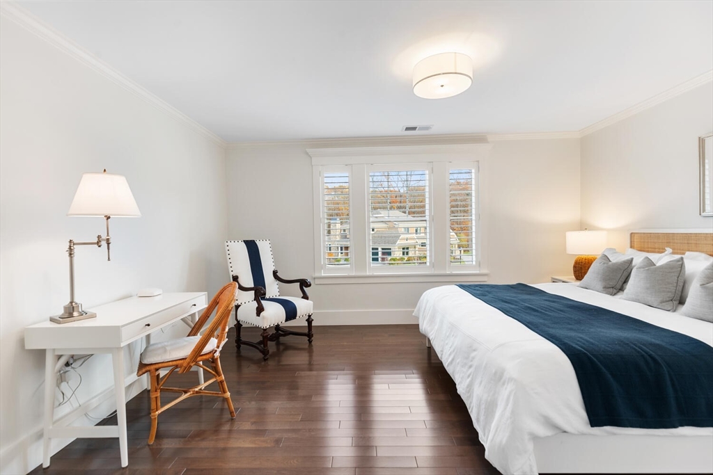 19 Gershon Way, Unit 1 Winchester, MA 01890 - Photo 36 of 42 a bedroom with a bed and a window