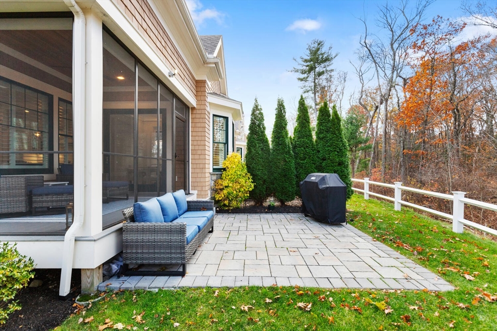 19 Gershon Way, Unit 1 Winchester, MA 01890 - Photo 40 of 42 a view of a patio with couches chairs and a potted plant