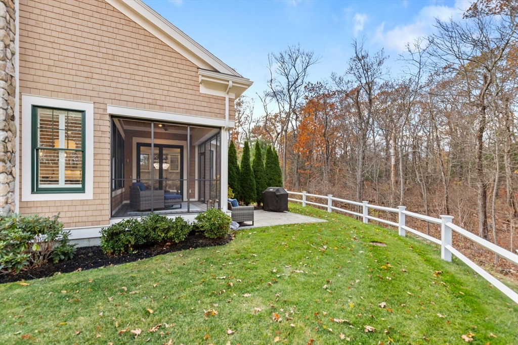 19 Gershon Way, Unit 1 Winchester, MA 01890 - Photo 42 of 42 a view of a house with backyard and sitting area