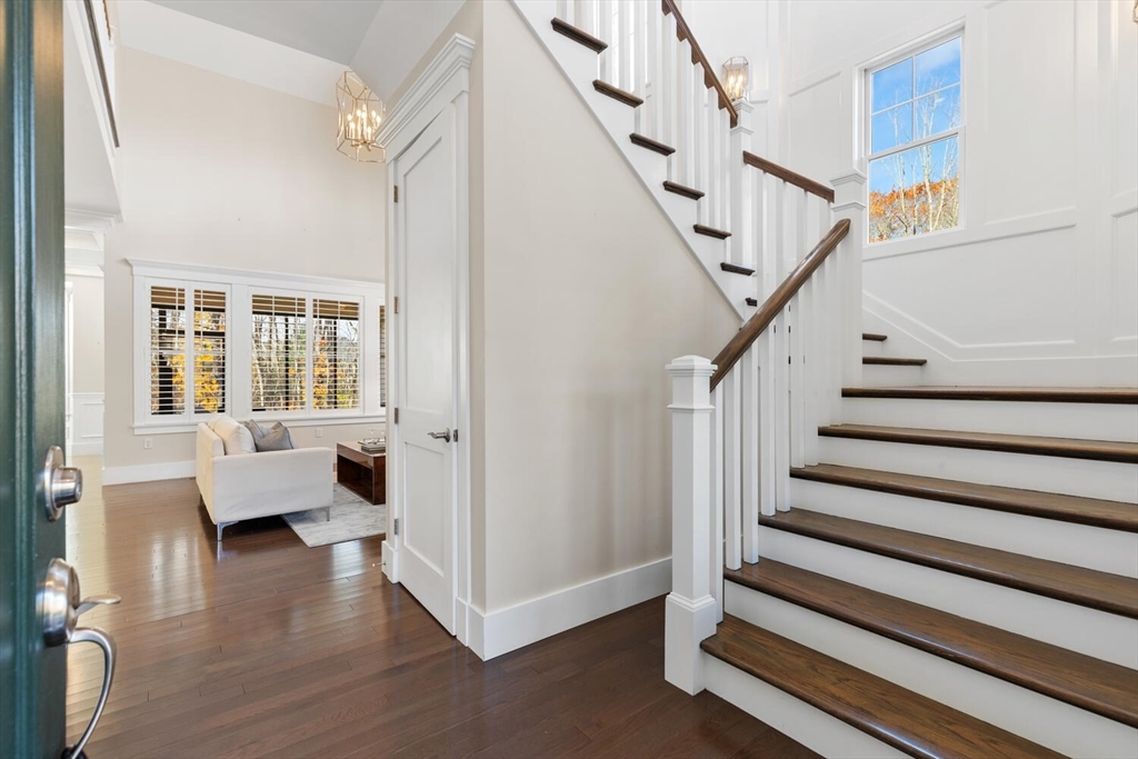 19 Gershon Way, Unit 1 Winchester, MA 01890 - Photo 6 of 42 a view of entryway with wooden floor and windows