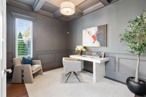 a work room with furniture and potted plants