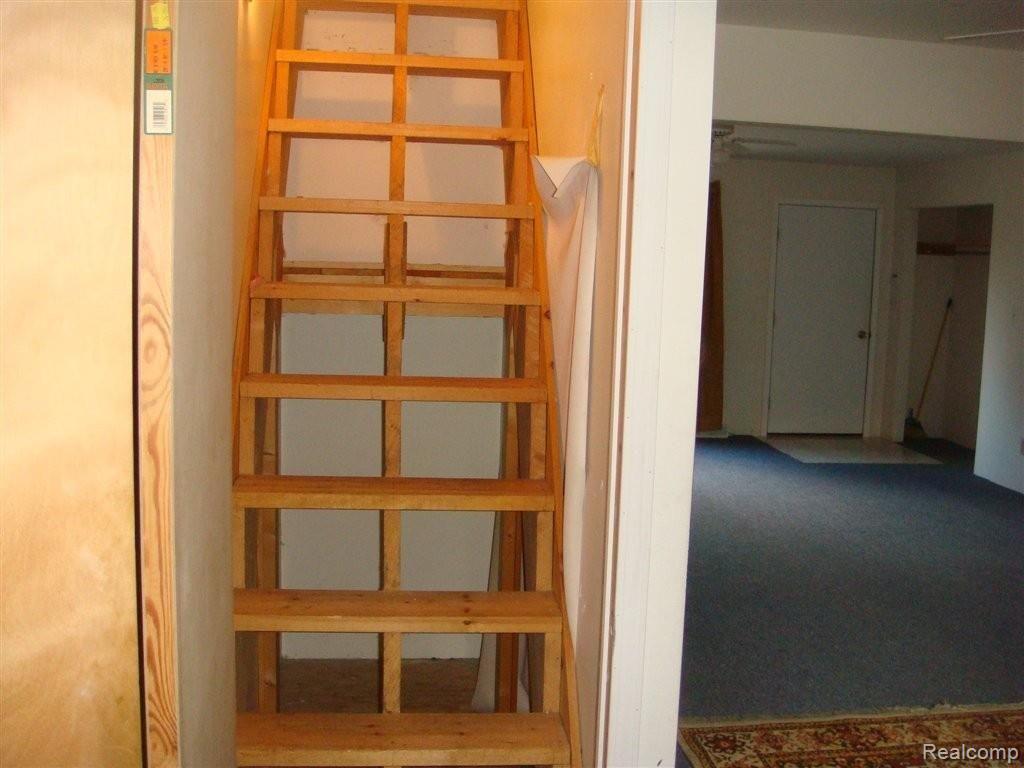 7115 Graham Road Jeddo, MI 48032 - Photo 8 of 23 stairway to potential bedrooms