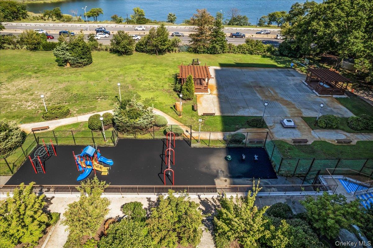 17-85 215th Street, Unit 5L Queens, NY 11360 - Photo 28 of 46 an aerial view of a house with a yard