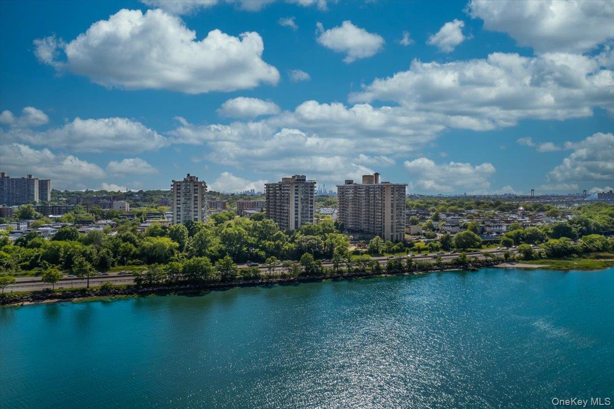 17-85 215th Street, Unit 5L Queens, NY 11360 - Photo 30 of 46 a view of a lake with a city