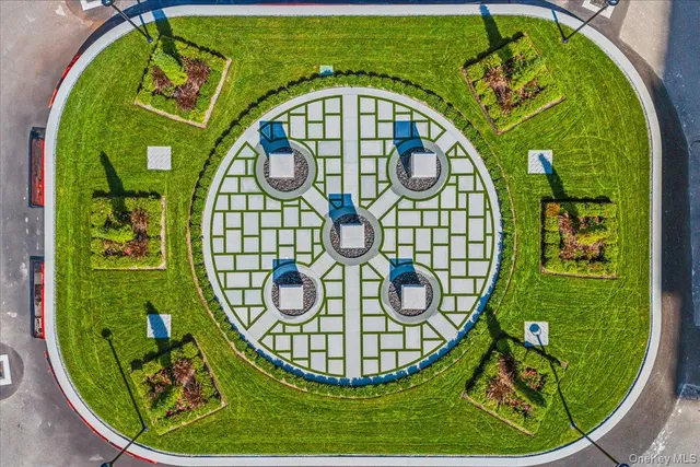 an outdoor sitting area with a swimming pool