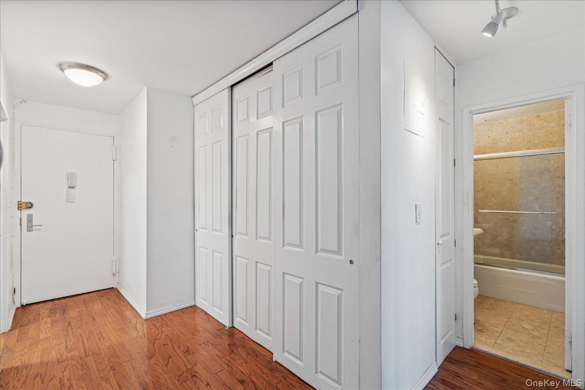 17-85 215th Street, Unit 5L Queens, NY 11360 - Photo 8 of 46 a view of a hallway with wooden floor