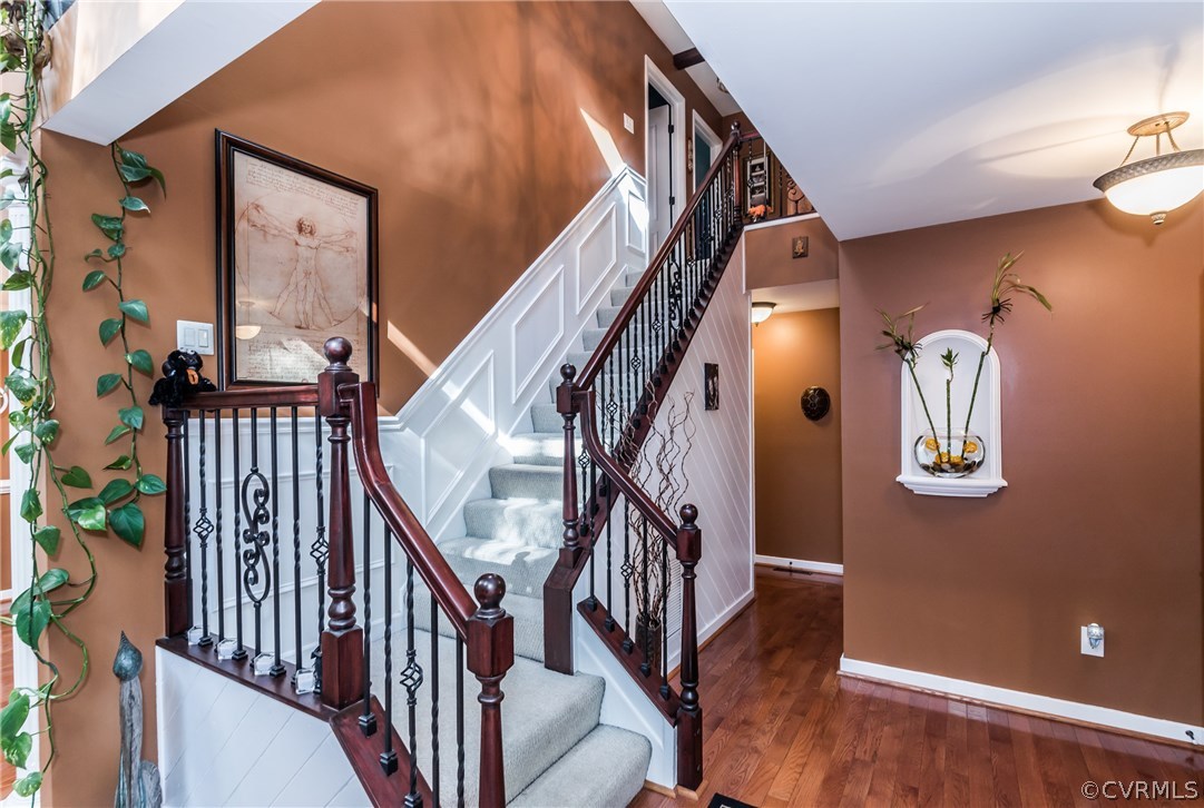 3216 Fortunes Ridge Road Midlothian, VA 23112 - Photo 20 of 41 a view of staircase with railing and a chandelier