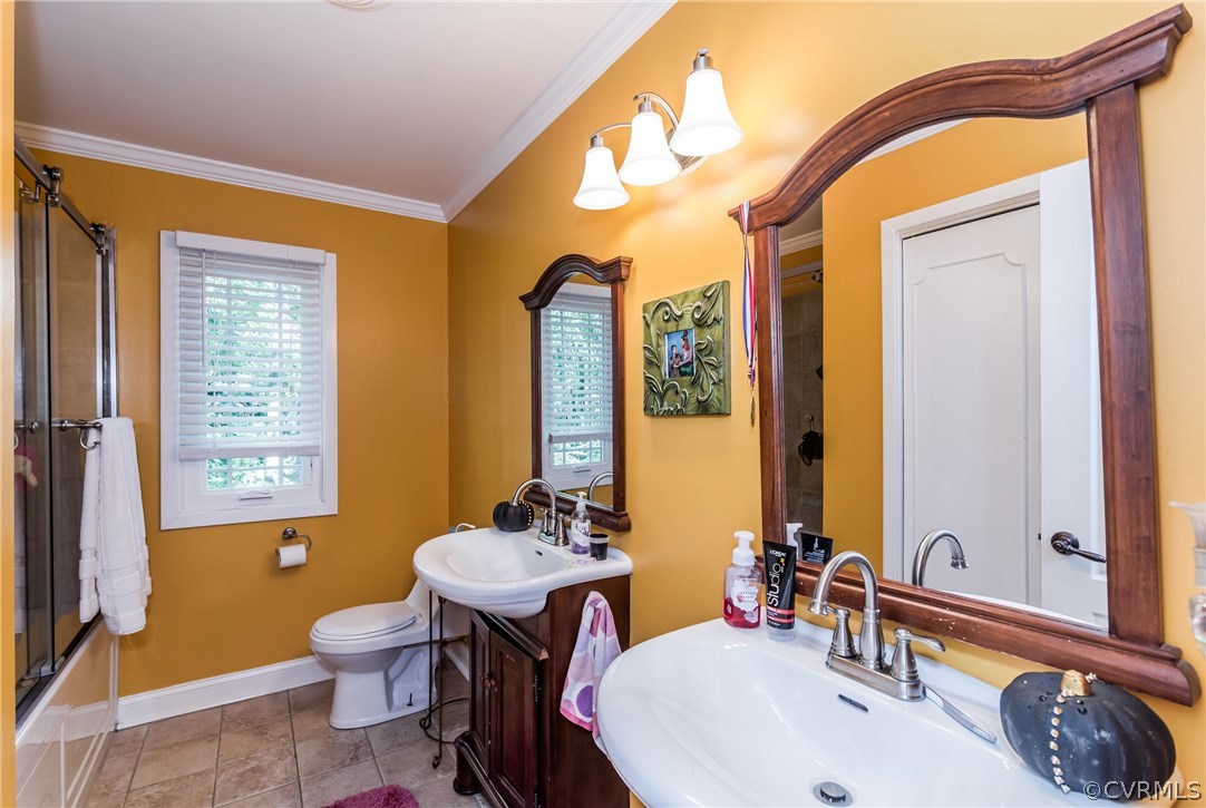 3216 Fortunes Ridge Road Midlothian, VA 23112 - Photo 32 of 41 a bathroom with a sink a toilet and a mirror