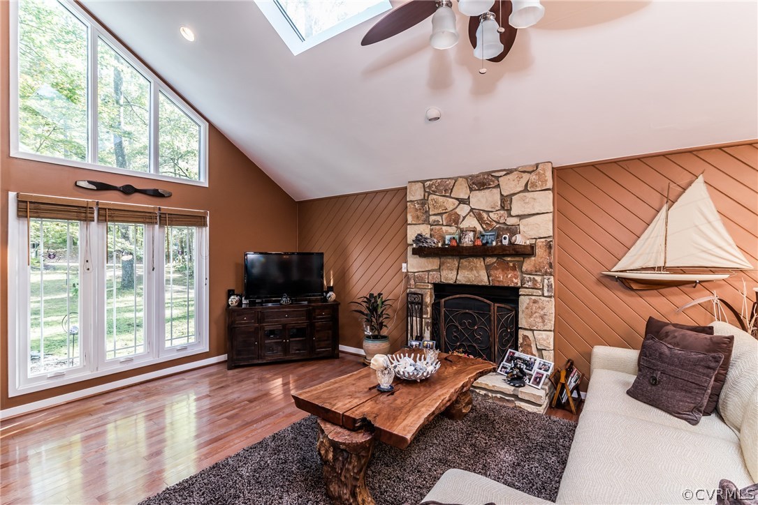 3216 Fortunes Ridge Road Midlothian, VA 23112 - Photo 7 of 41 a living room with furniture a fireplace and a floor to ceiling window