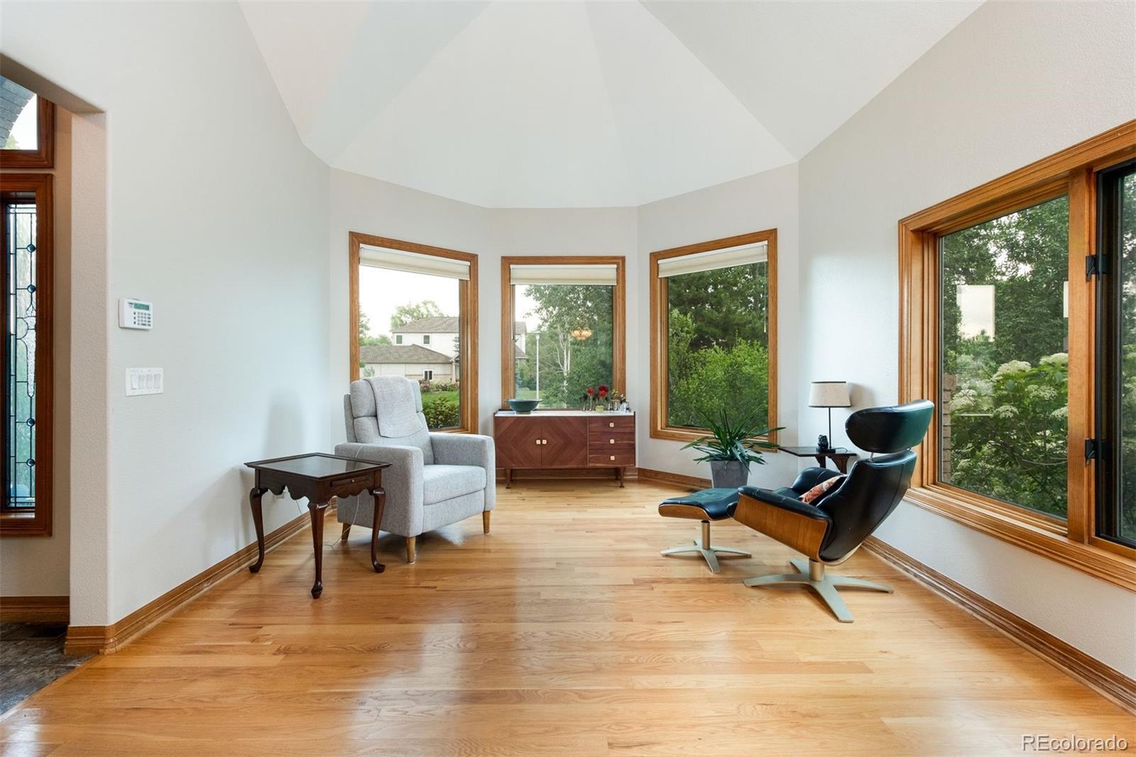 3935 Pierson Street Wheat Ridge, CO 80033 - Photo 11 of 50 a living room with furniture and large windows