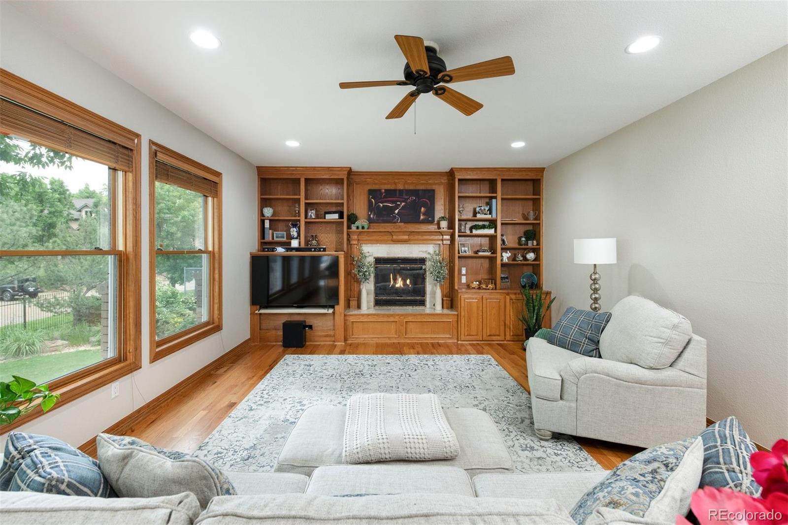 3935 Pierson Street Wheat Ridge, CO 80033 - Photo 15 of 50 a living room with furniture and a fireplace