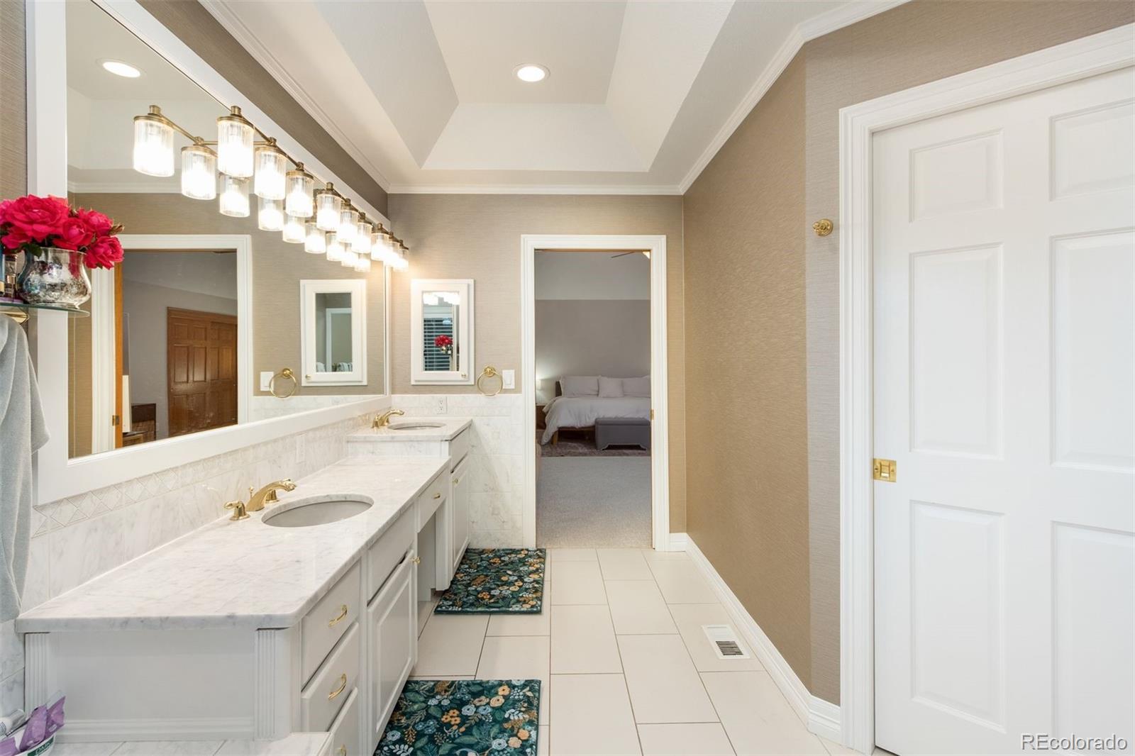 3935 Pierson Street Wheat Ridge, CO 80033 - Photo 26 of 50 a bathroom with a sink vanity and a mirror