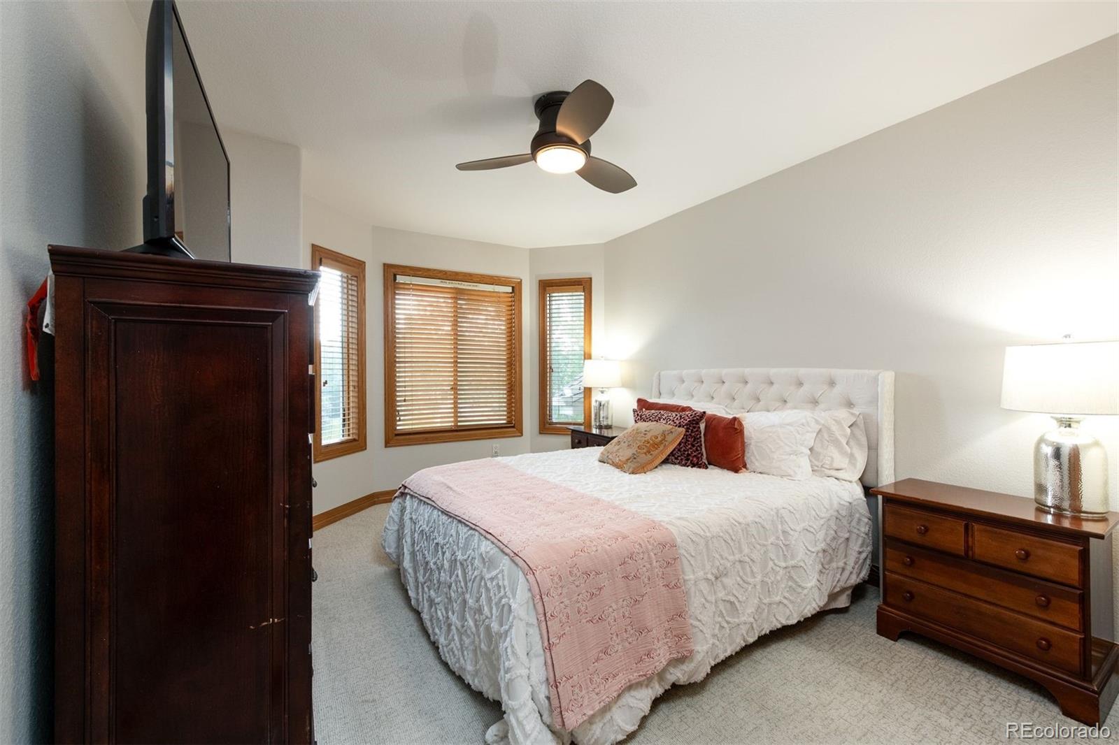 3935 Pierson Street Wheat Ridge, CO 80033 - Photo 29 of 50 a bedroom with a bed and window