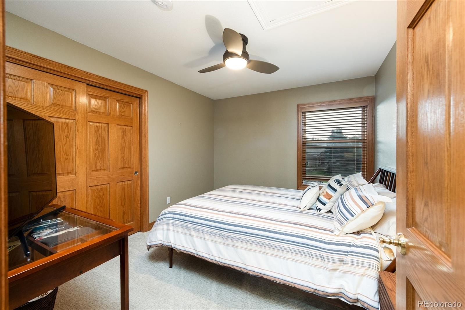 3935 Pierson Street Wheat Ridge, CO 80033 - Photo 31 of 50 a bedroom with a bed and a window