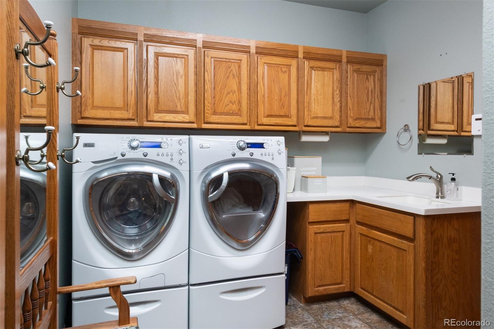 3935 Pierson Street Wheat Ridge, CO 80033 - Photo 40 of 50 a utility room with sink dryer and washer