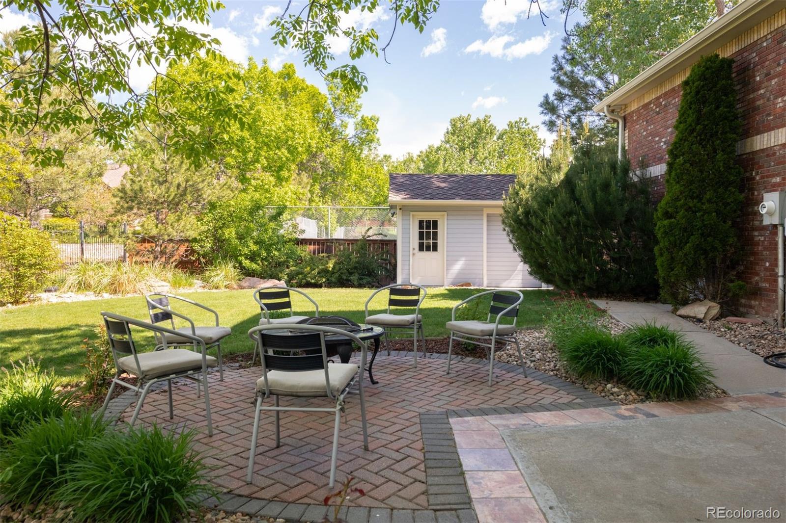 3935 Pierson Street Wheat Ridge, CO 80033 - Photo 46 of 50 a view of a patio with table and chairs and potted plants