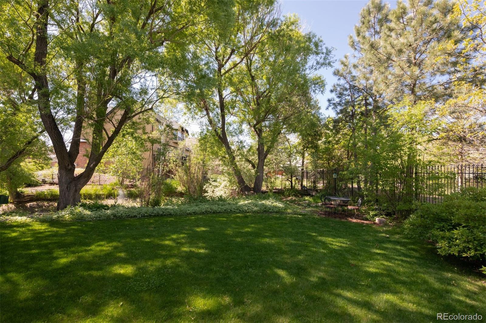 3935 Pierson Street Wheat Ridge, CO 80033 - Photo 5 of 50 a backyard of a house with lots of green space