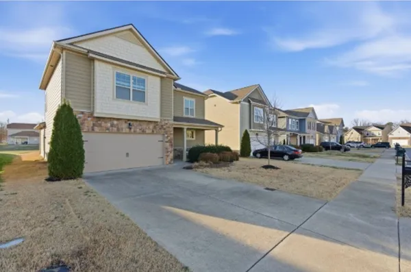 a view of multiple houses with a street