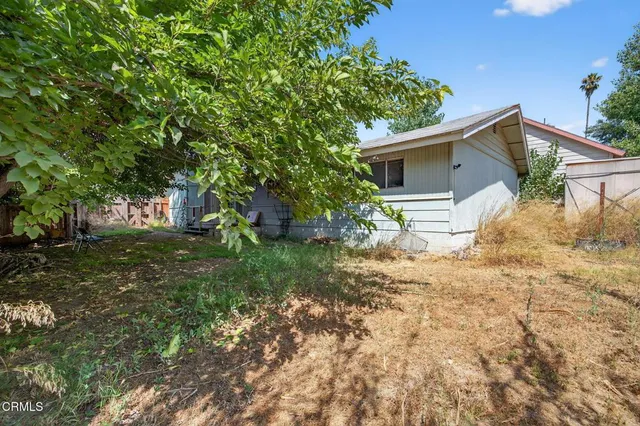 a backyard of a house with lots of green space