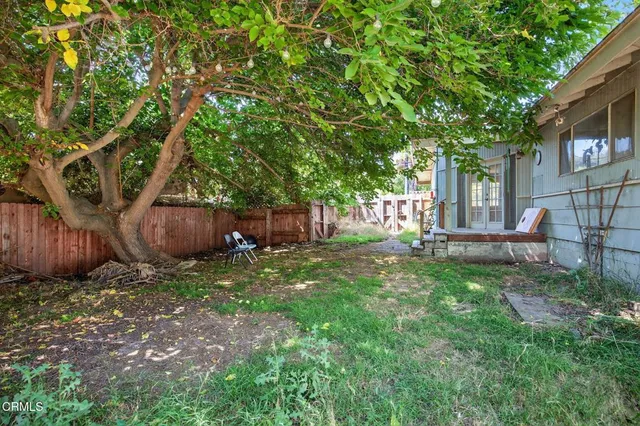 a view of outdoor space and front view of a house