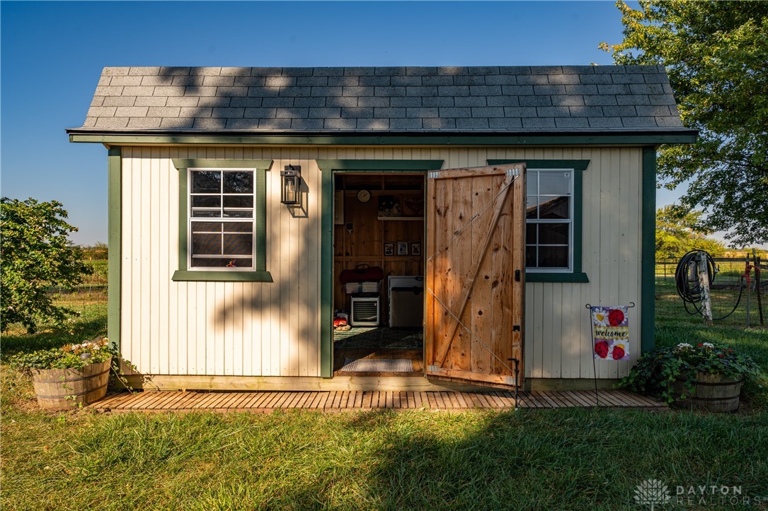 1599 Garringer Road Jamestown, OH 45335 - Photo 46 of 73 This quaint shed offers versatile outdoor storage and a charming accent to your landscape.