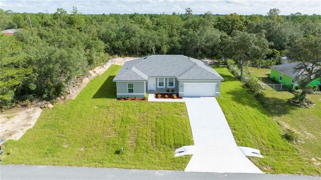 4147 Southwest 167th Street Ocala, FL 34473 - Photo 2 of 45 a aerial view of a house