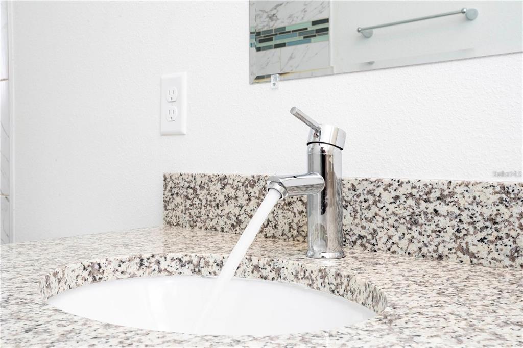 4147 Southwest 167th Street Ocala, FL 34473 - Photo 24 of 45 a bathroom with a sink and a mirror