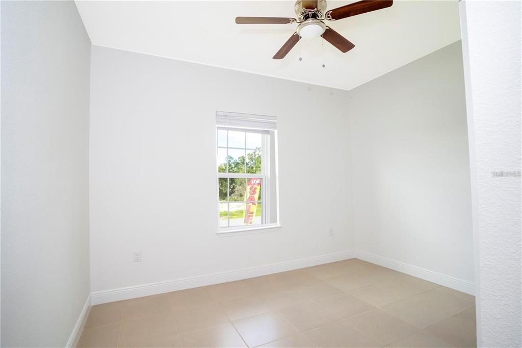4147 Southwest 167th Street Ocala, FL 34473 - Photo 34 of 45 an empty room with windows and fan