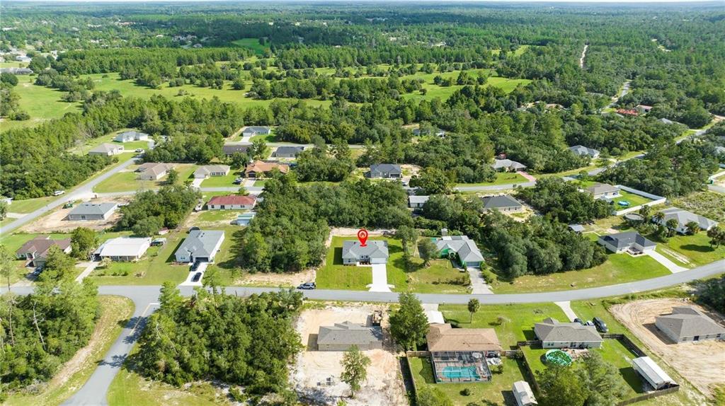 4147 Southwest 167th Street Ocala, FL 34473 - Photo 4 of 45 an aerial view of residential houses with outdoor space and trees