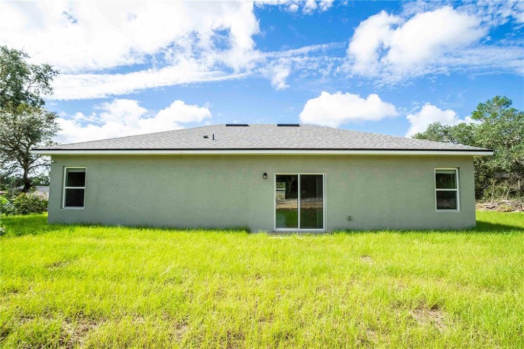 4147 Southwest 167th Street Ocala, FL 34473 - Photo 43 of 45 a view of house with yard and swimming pool