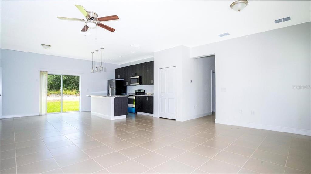 4147 Southwest 167th Street Ocala, FL 34473 - Photo 6 of 45 a view of a kitchen with a sink and a microwave