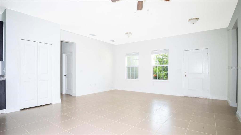 4147 Southwest 167th Street Ocala, FL 34473 - Photo 9 of 45 an empty room with windows and entrance