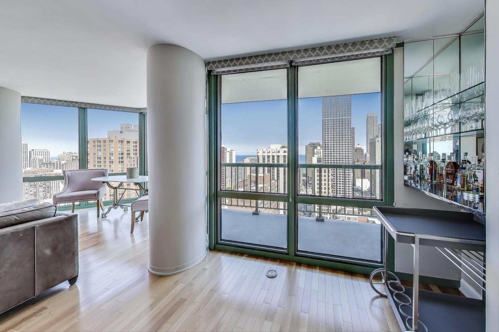 111 West Maple Street, Unit 2601 Chicago, IL 60610 - Photo 7 of 23 a view of a livingroom with furniture and hardwood floor