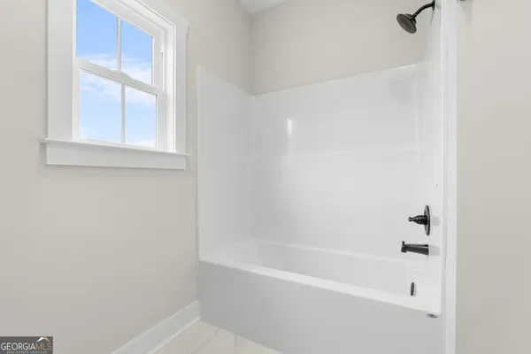 a close up of a bathtub in a bathroom