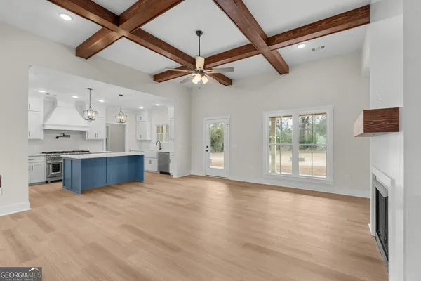 a view of kitchen with granite countertop cabinets and outdoor space