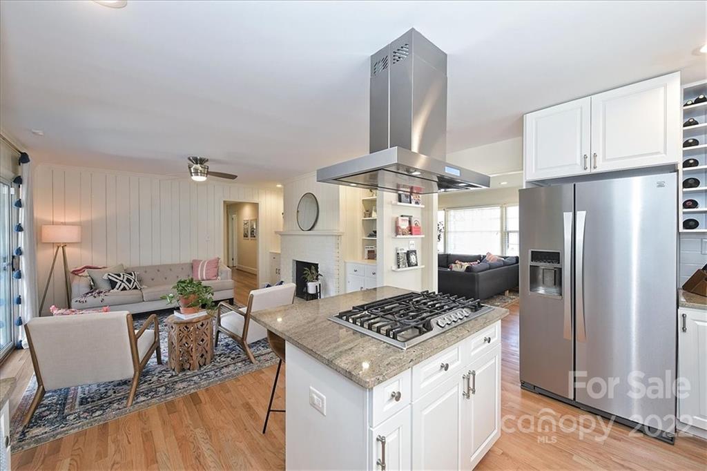 5638 Londonderry Road Charlotte, NC 28210 - Photo 21 of 44 a kitchen with a table chairs stove and refrigerator