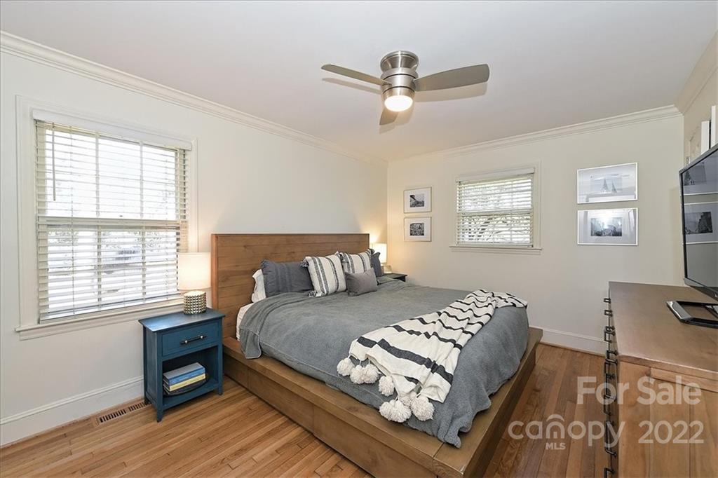 5638 Londonderry Road Charlotte, NC 28210 - Photo 23 of 44 a bedroom with a bed and a tv on the dresser