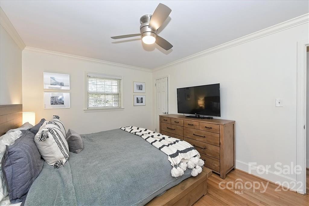 5638 Londonderry Road Charlotte, NC 28210 - Photo 24 of 44 a bedroom with a bed and a flat screen tv