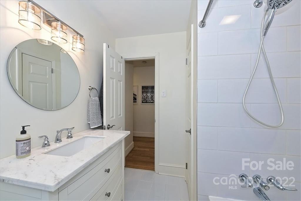 5638 Londonderry Road Charlotte, NC 28210 - Photo 31 of 44 a bathroom with a sink vanity and a mirror